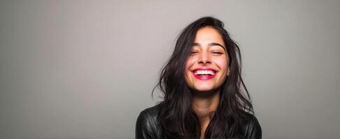 The joyful woman embracing life with a radiant smile and warm personality photo