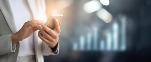 The professional using smartphone to analyze business growth data. photo