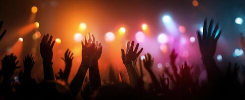 The vibrant crowd at a live concert under dazzling stage lights. photo