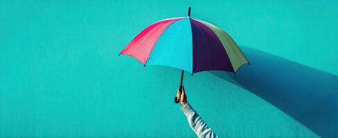 The Colorful Umbrella Against a Bright Blue Wall photo