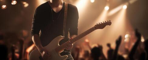 The electrifying guitarist captivating the audience during a live performance. photo