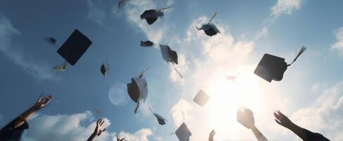 The joyful celebration of graduates throwing caps into the bright blue sky. photo