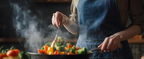 The chef skillfully prepares a delicious medley of fresh vegetables in the kitchen. photo