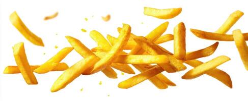 The crispy golden fries falling artfully against a white background. photo