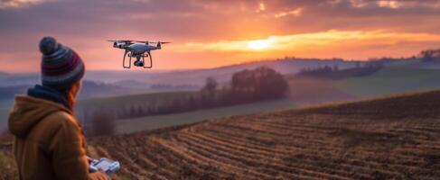 The drone flying over a beautiful sunset landscape during an outdoor adventure. photo