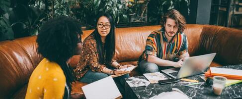 The creative team collaborating in a vibrant and casual workspace. photo