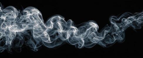 The Swirling Movement of Elegant Smoke Against a Dark Background photo