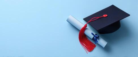 The graduation cap and diploma celebrating academic achievement and success. photo