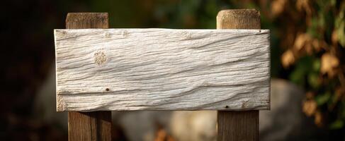 The rustic wooden sign with a textured surface for creative outdoor displays. photo
