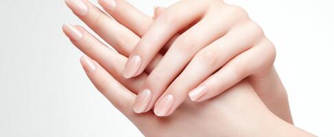 The delicate beauty of manicured hands in a minimalist setting. photo