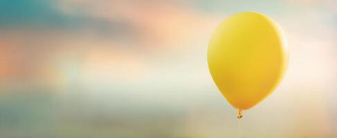 The Yellow Balloon Floating in a Dreamy Sky Background photo