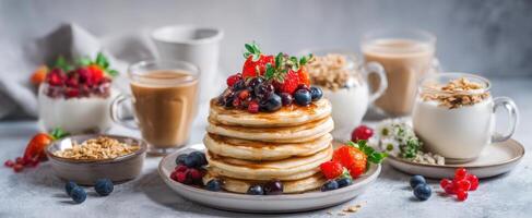 The delicious stack of fluffy pancakes topped with fresh berries and syrup. photo