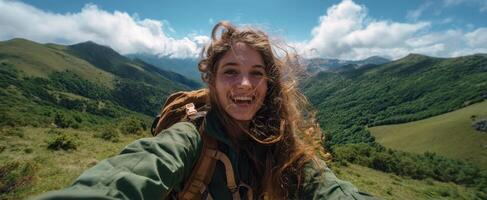 The adventurous young woman enjoying a sunny day in the mountains. photo