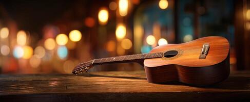 The Acoustic Guitar Resting on a Wooden Table in a Cozy Atmosphere photo