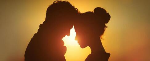 The intimate silhouette of a loving couple against a stunning sunset backdrop. photo