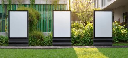 The blank advertising billboards surrounded by lush greenery in a modern setting. photo