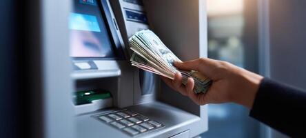 The ATM dispensing cash to a customer in a modern banking environment. photo