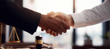 The handshake signifying partnership and collaboration in a legal environment. photo
