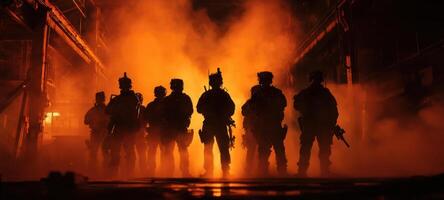 The silhouettes of soldiers emerge from smoke in an intense military scene. photo