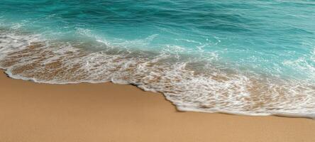 The tranquil beach scene with gentle waves and clear turquoise waters. photo