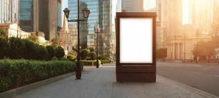 The blank billboard standing prominently in a vibrant cityscape at sunset. photo