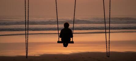 The swing overlooking the serene beach at sunset for moments of reflection. photo
