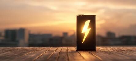 The illuminated battery symbolizing energy and innovation during a vibrant sunset. photo