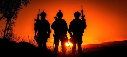 The silhouette of soldiers against a breathtaking sunset backdrop. photo