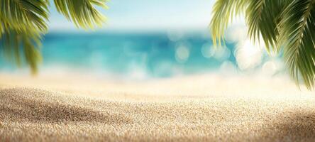 The tranquil beach scene framed by lush palm leaves and sparkling ocean. photo