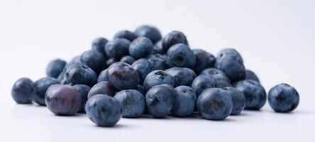 The stunning pile of fresh blueberries on a white background photo