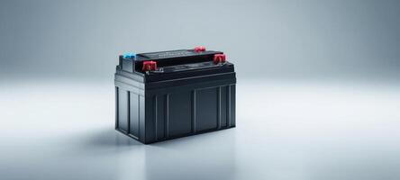 The high-performance automotive battery on a sleek gradient background. photo
