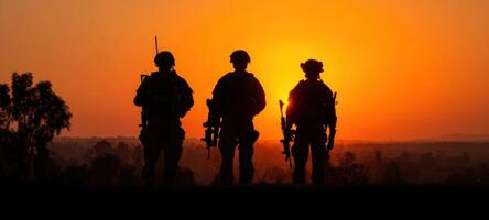 The soldiers standing united against a dramatic sunset backdrop. photo