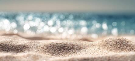 The tranquil beach with soft sand and sparkling ocean waves in background. photo