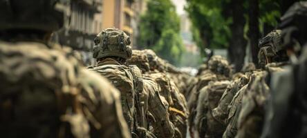 The soldiers marching in formation through a vibrant city street. photo