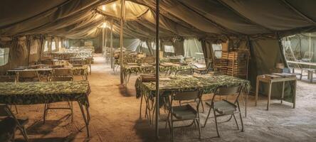 The spacious military tent interior with organized tables and comfortable seating. photo