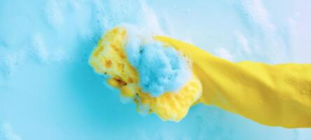 The yellow sponge gliding through bubbles in a sparkling clean environment. photo