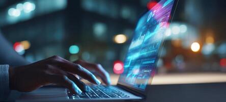 The laptop displaying dynamic data on a screen at night in an urban setting. photo