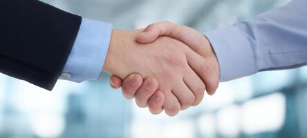 The handshake symbolizing successful business partnership and collaboration in the corporate world. photo