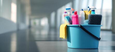 The vibrant bucket filled with various cleaning supplies for efficient housekeeping. photo
