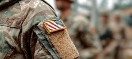 The soldier showcasing the American flag on their military uniform. photo