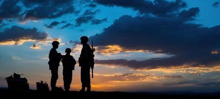 The soldiers mentoring a child during a stunning sunset silhouette. photo