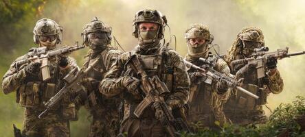 The group of soldiers prepared for action in a dense, wooded environment. photo
