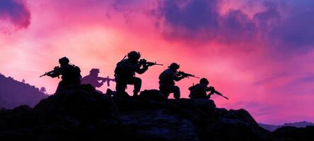 The soldiers stand strong silhouetted against a vibrant sunset sky. photo