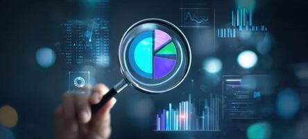 The magnifying glass focusing on pie chart and data analysis visualization photo