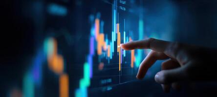 The finger touches a digital finance chart for market analysis and insights. photo
