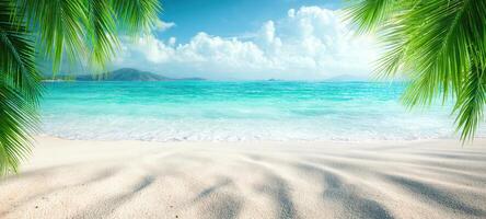 The tranquil beach scene with turquoise water and lush tropical foliage. photo