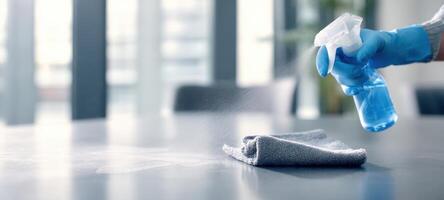 The Cleaning Process with Spray Bottle and Cloth on a Shiny Surface photo