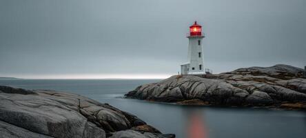 The iconic lighthouse stands resilient against the moody ocean backdrop. photo