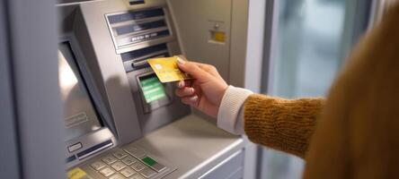 The ATM machine being used for a secure banking transaction by a customer. photo