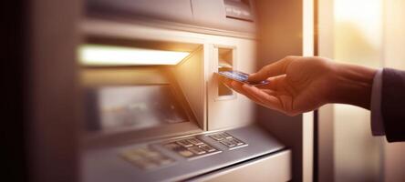 The Hand Inserting Card Into ATM Machine for a Quick Transaction photo